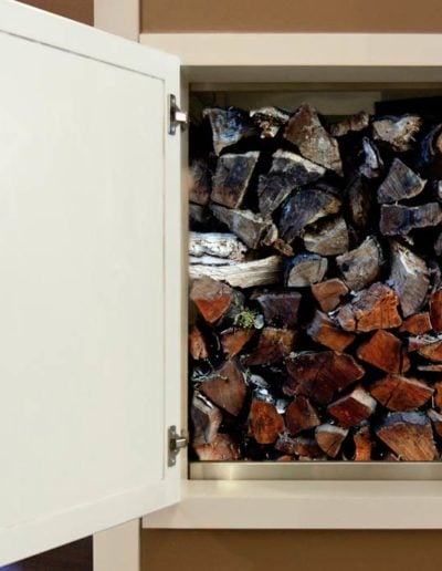 A dumbwaiter stacked with firewood