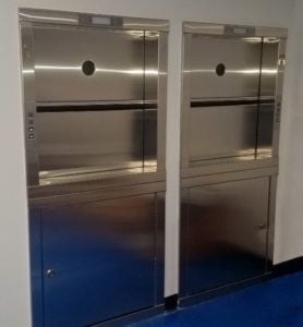 Residential Powerlift 300 dumbwaiter with stainless steel access doors in a finished hallway