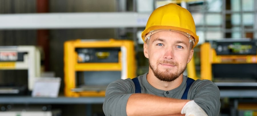 The smiling face of a man with a hard hat on who is ready to help our dumbwaiter customers as soon as they contact us